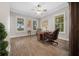 Home office with wood floors, large windows, and built-in shelving at 2704 Se 31St St, Ocala, FL 34471