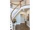 Elegant curved staircase with white railings and hardwood steps at 2704 Se 31St St, Ocala, FL 34471