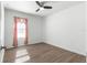 Spacious bedroom with ceiling fan and wood-look floors at 3853 Se 99Th Ln, Belleview, FL 34420