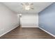 Bright bedroom featuring neutral walls, ceiling fan, and wood-look vinyl flooring at 3853 Se 99Th Ln, Belleview, FL 34420