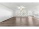 Spacious living room with wood-look floors and ceiling fan at 3853 Se 99Th Ln, Belleview, FL 34420