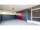 Attached carport with red doors and a screened enclosure at 481 Spring Ln, Ocala, FL 34472