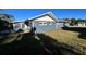 Gray house exterior with a screened patio and a large backyard at 481 Spring Ln, Ocala, FL 34472