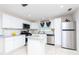 Modern kitchen with white cabinets, granite counters, and island at 481 Spring Ln, Ocala, FL 34472