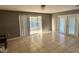 Spacious living area with tile floors and access to a patio at 481 Spring Ln, Ocala, FL 34472