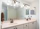 Bathroom boasts double sinks and a large vanity mirror at 4939 Nw 82Nd Ct, Ocala, FL 34482