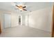 Bright bedroom with ceiling fan, carpet, and access to bathroom at 6287 Sw 106Th Pl, Ocala, FL 34476