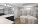 Bathroom boasts a large shower, garden tub, and double sinks at 7403 Ne 22Nd Court Rd, Ocala, FL 34479
