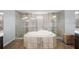 Spa-like bathroom with soaking tub, walk-in shower, and double vanity at 7403 Ne 22Nd Court Rd, Ocala, FL 34479