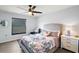 Bedroom with queen-size bed, built-in shelving and ceiling fan at 7403 Ne 22Nd Court Rd, Ocala, FL 34479