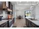 Open kitchen with stainless steel appliances and breakfast bar at 7403 Ne 22Nd Court Rd, Ocala, FL 34479