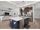 Modern kitchen with large island, stainless steel appliances, and ample counter space at 7403 Ne 22Nd Court Rd, Ocala, FL 34479