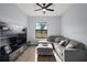 Bright living room featuring an L-shaped sofa and built-in shelving at 7403 Ne 22Nd Court Rd, Ocala, FL 34479