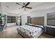 Large main bedroom with king-size bed, and hardwood floors at 7403 Ne 22Nd Court Rd, Ocala, FL 34479