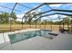 Screened pool with a spacious deck and seating at 7403 Ne 22Nd Court Rd, Ocala, FL 34479