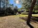 Large backyard with two sheds and mature trees at 7535 Sw 185 Avenue Rd, Dunnellon, FL 34432