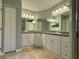 Double vanity bathroom with granite countertop at 7535 Sw 185 Avenue Rd, Dunnellon, FL 34432