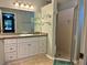 Bathroom with vanity, shower, and glass enclosure at 7535 Sw 185 Avenue Rd, Dunnellon, FL 34432