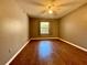 Bedroom with wood-look flooring and ceiling fan at 7535 Sw 185 Avenue Rd, Dunnellon, FL 34432
