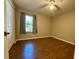 Bedroom with wood-look flooring and window at 7535 Sw 185 Avenue Rd, Dunnellon, FL 34432