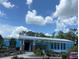 Community center with blue exterior and landscaping at 7535 Sw 185 Avenue Rd, Dunnellon, FL 34432