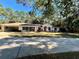 Front view of house with a two-car garage and circular driveway at 7535 Sw 185 Avenue Rd, Dunnellon, FL 34432