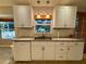 Kitchen sink and dishwasher with granite countertop at 7535 Sw 185 Avenue Rd, Dunnellon, FL 34432