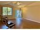 Bright living room with laminate flooring and large windows at 7535 Sw 185 Avenue Rd, Dunnellon, FL 34432