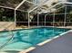Refreshing screened-in pool perfect for outdoor enjoyment at 7535 Sw 185 Avenue Rd, Dunnellon, FL 34432
