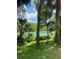 Serene riverbank with a bench, offering a peaceful escape at 7535 Sw 185 Avenue Rd, Dunnellon, FL 34432
