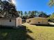 View of home's side with a shed and spacious yard at 7535 Sw 185 Avenue Rd, Dunnellon, FL 34432