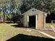 Workshop or storage building with open doors revealing interior space at 7535 Sw 185 Avenue Rd, Dunnellon, FL 34432