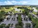 Aerial view of a clubhouse with a large parking lot at 8520 Sw 52Nd Lane Rd, Ocala, FL 34481