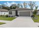 Charming one-story home with gray siding, landscaping, and driveway at 8520 Sw 52Nd Lane Rd, Ocala, FL 34481