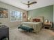 Main bedroom with large window, ceiling fan and stylish decor at 8520 Sw 52Nd Lane Rd, Ocala, FL 34481