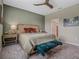 Spacious bedroom with ceiling fan, large window and stylish decor at 8520 Sw 52Nd Lane Rd, Ocala, FL 34481