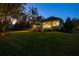 Expansive backyard with a covered patio and outdoor lighting at 8725 Nw 31St Lane Rd, Ocala, FL 34482