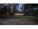 Peaceful backyard view, showcasing a deck and lush landscaping at 8725 Nw 31St Lane Rd, Ocala, FL 34482