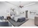 Spacious main bedroom with a king-size bed and sitting area at 8725 Nw 31St Lane Rd, Ocala, FL 34482