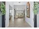 Bright and spacious entryway with hardwood floors and a view into the living room at 8725 Nw 31St Lane Rd, Ocala, FL 34482