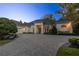 Stunning curb appeal, featuring a paver driveway and a two-car garage at 8725 Nw 31St Lane Rd, Ocala, FL 34482