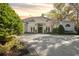 Beautiful home exterior showcasing a white facade and a spacious driveway at 8725 Nw 31St Lane Rd, Ocala, FL 34482