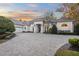 Stunning curb appeal featuring a white two-story house and a large driveway at 8725 Nw 31St Lane Rd, Ocala, FL 34482