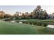 Serene golf course view with water feature and green at 8725 Nw 31St Lane Rd, Ocala, FL 34482