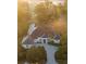 Luxury home with a large driveway and brown roof at 8725 Nw 31St Lane Rd, Ocala, FL 34482