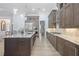 Modern kitchen with island, stainless steel appliances, and custom cabinetry at 8725 Nw 31St Lane Rd, Ocala, FL 34482