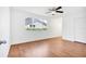 Bright bedroom with wood floors, ceiling fan, and spacious closet at 10962 Sw 81St Ave, Ocala, FL 34481
