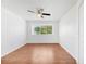 Bright bedroom with wood floors, window, and ceiling fan at 10962 Sw 81St Ave, Ocala, FL 34481
