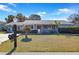 Front view of a single story home with for sale sign at 10962 Sw 81St Ave, Ocala, FL 34481