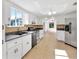 Open kitchen with stainless steel appliances and view to living room at 10962 Sw 81St Ave, Ocala, FL 34481